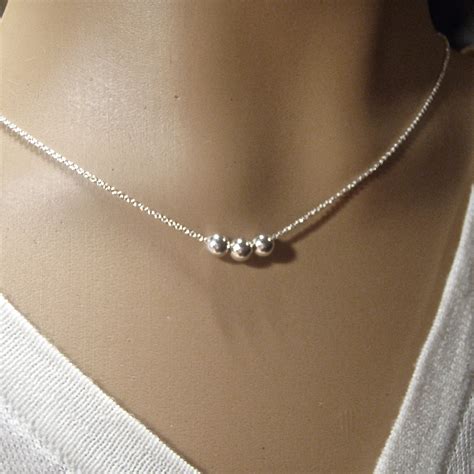 testicle jewelry|silver ball bead necklace.